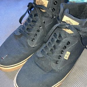 Black high top Harley Davidson shoes blemish on tip of right to toe.but clean